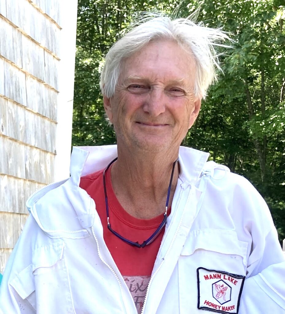 photo of Frank Drummond in beekeeping suit